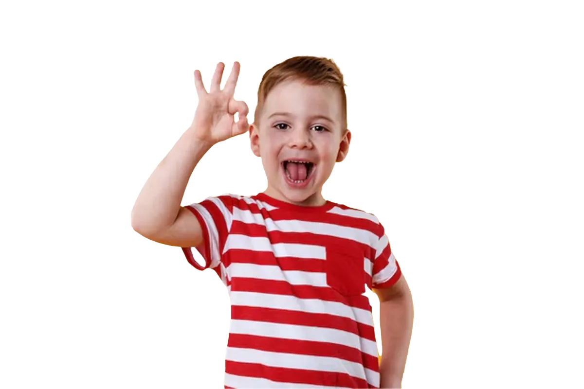Excited boy in a striped shirt giving an OK hand sign, representing confident, joyful learning at Oratrics